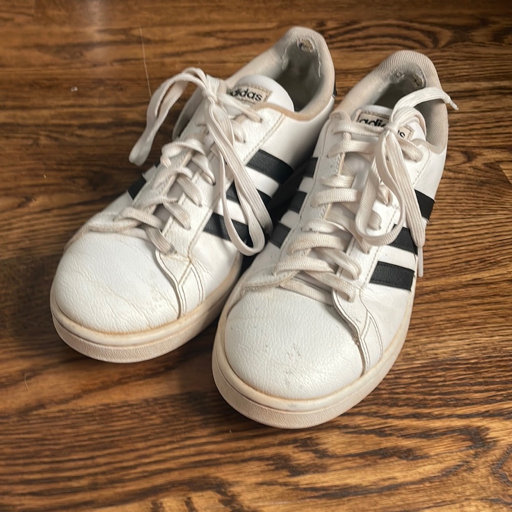 White and black stripped adidas shoe